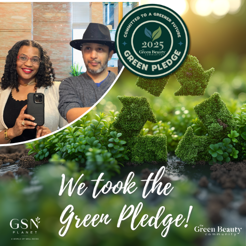 A married power couple started Vamp Boss a clean beauty and grooming brand and they are taking a selfie in the mirror together. The wife wears a suit jacket and blouse, the husband wears a stylish fedora and vneck grey sweater. On the photo is a badge stating : Committed to a greener future with the Green Pledge 2025, an initiative by Green Beauty Foundation and the Green Spa Network.